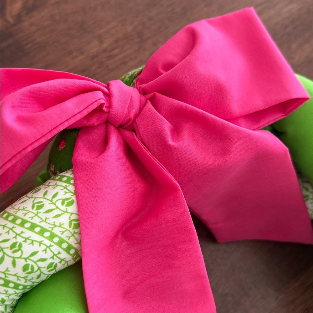 Vintage braided fabric plush wreath with pink ribbon